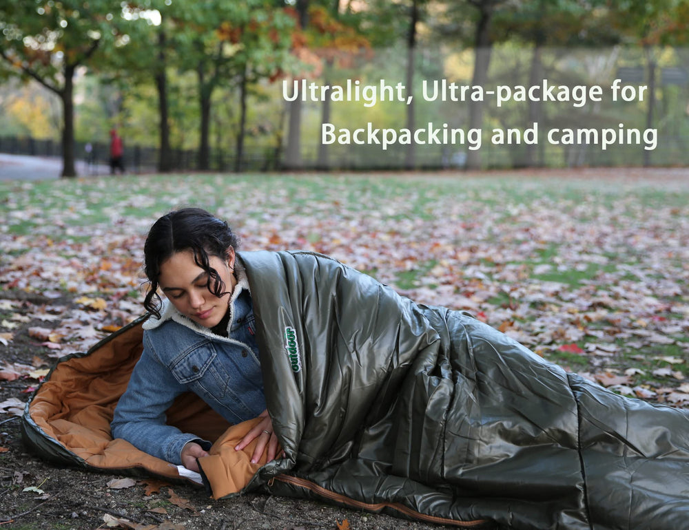 outdoor on-green compression sack packed beside water bottle for scale and portability