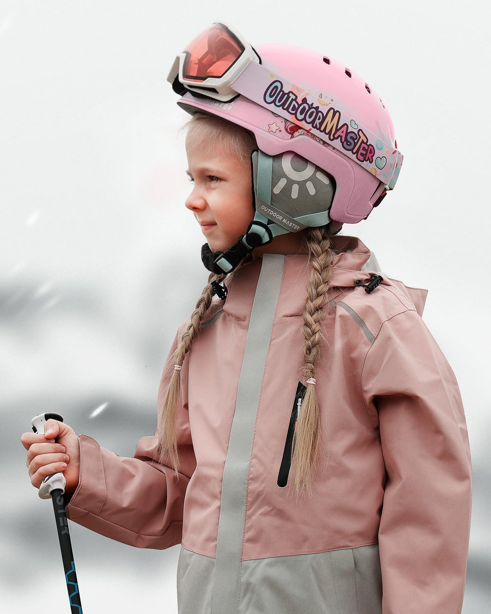 OutdoorMaster child wearing helmet and goggles to display size, fit and scale