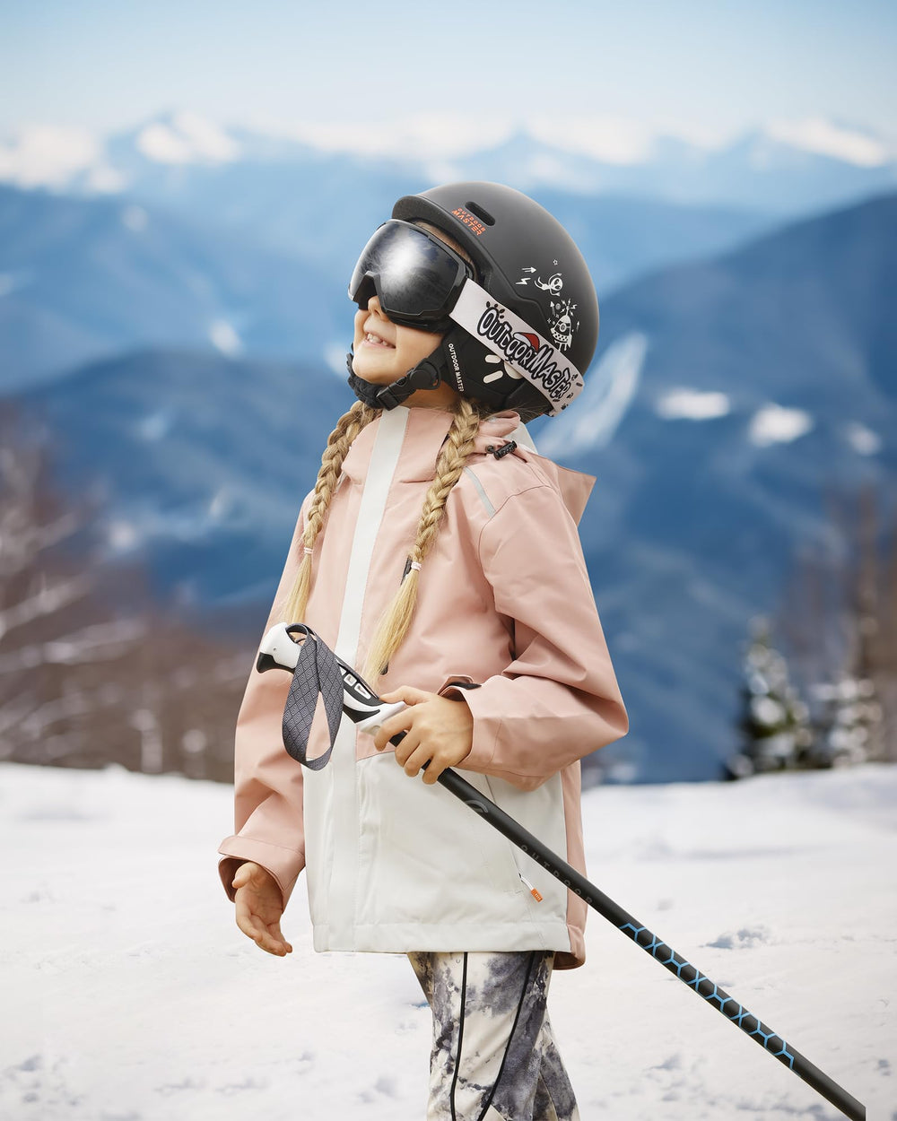 OutdoorMaster child wearing helmet on slope showcasing comfortable protection
