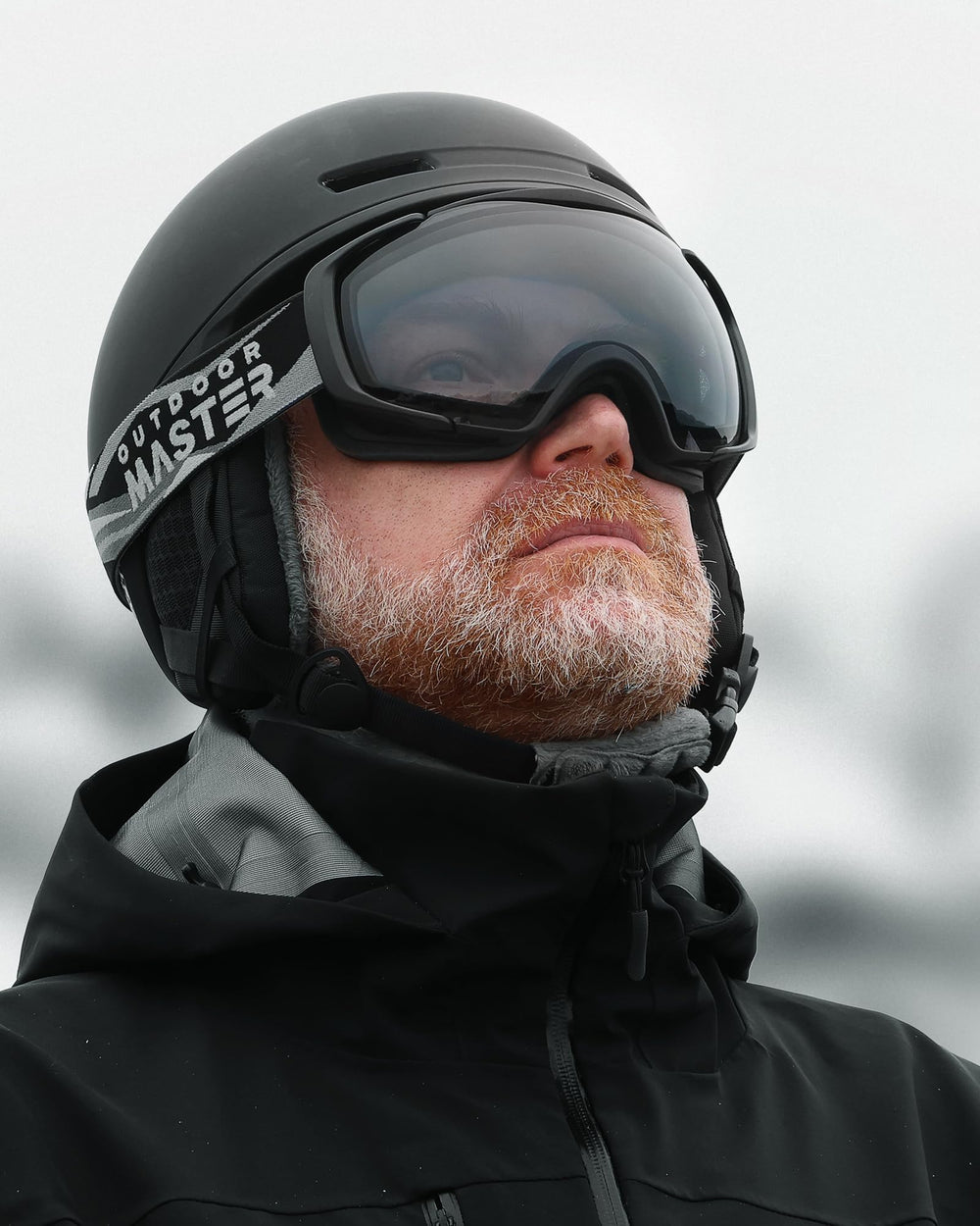 OutdoorMaster goggles worn by skier on slope improving visibility and eye safety