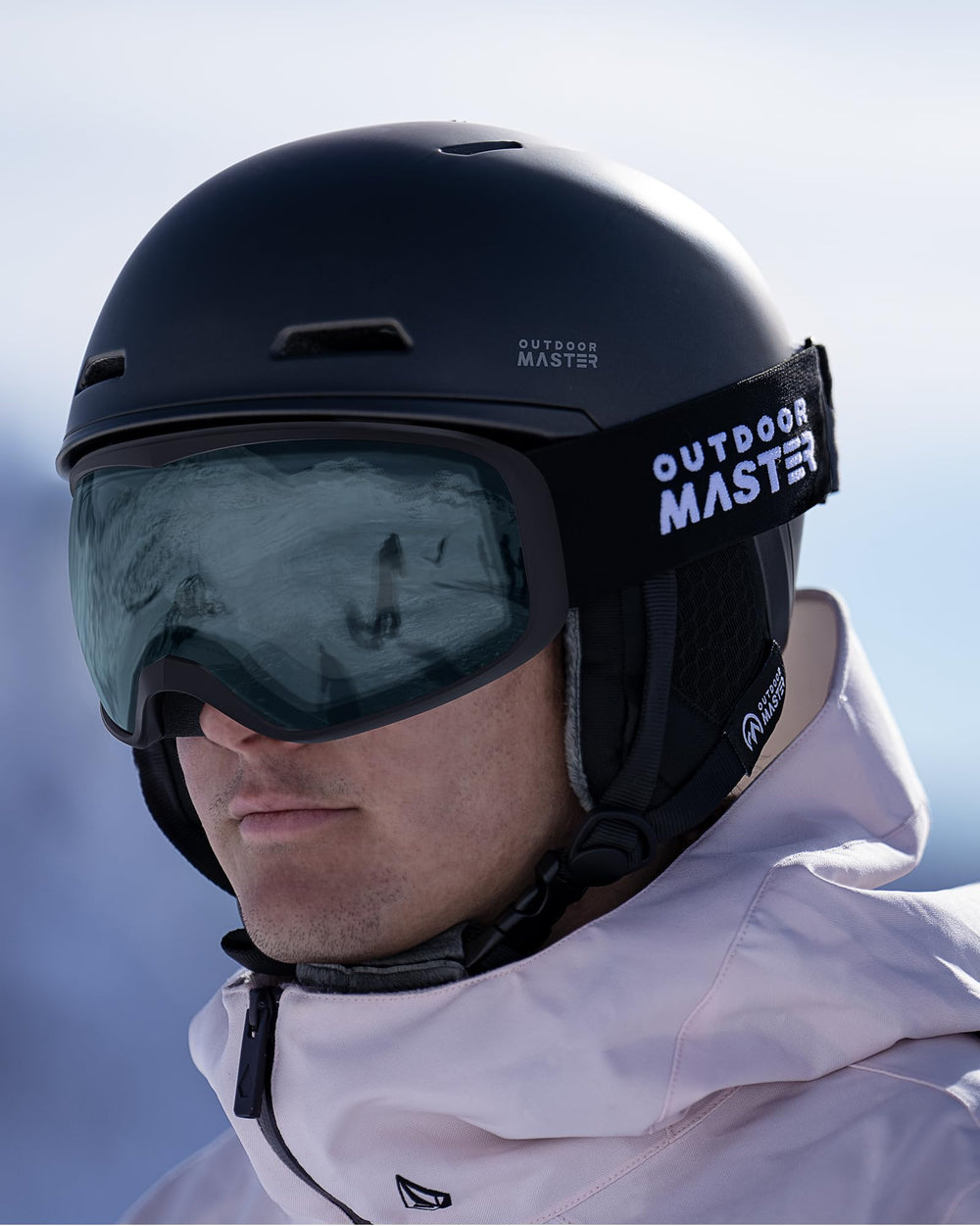 OutdoorMaster Owl on skier mid-run showing clear vision and UV400 protection