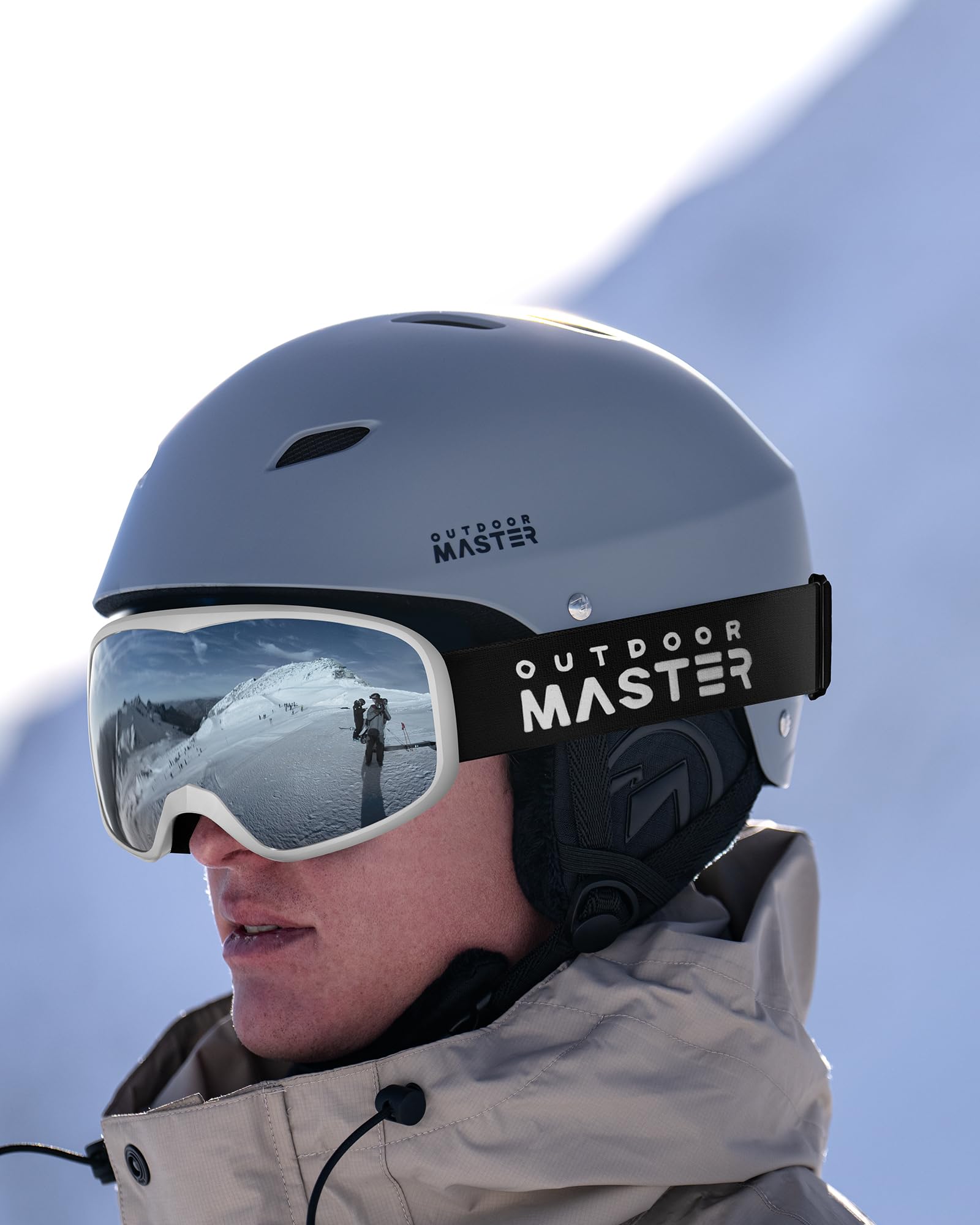 OutdoorMaster Owl lifestyle shot at resort showing clear vision on slopes
