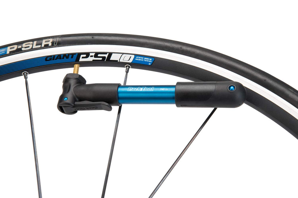 Park Tool pump mounted under a bottle cage, secure attachment and low profile