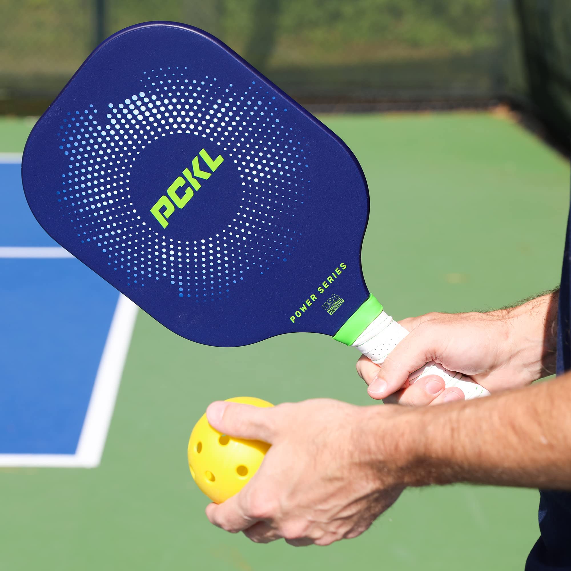 PCKL graphite face closeup showing rough-grit texture for improved spin and ball bite