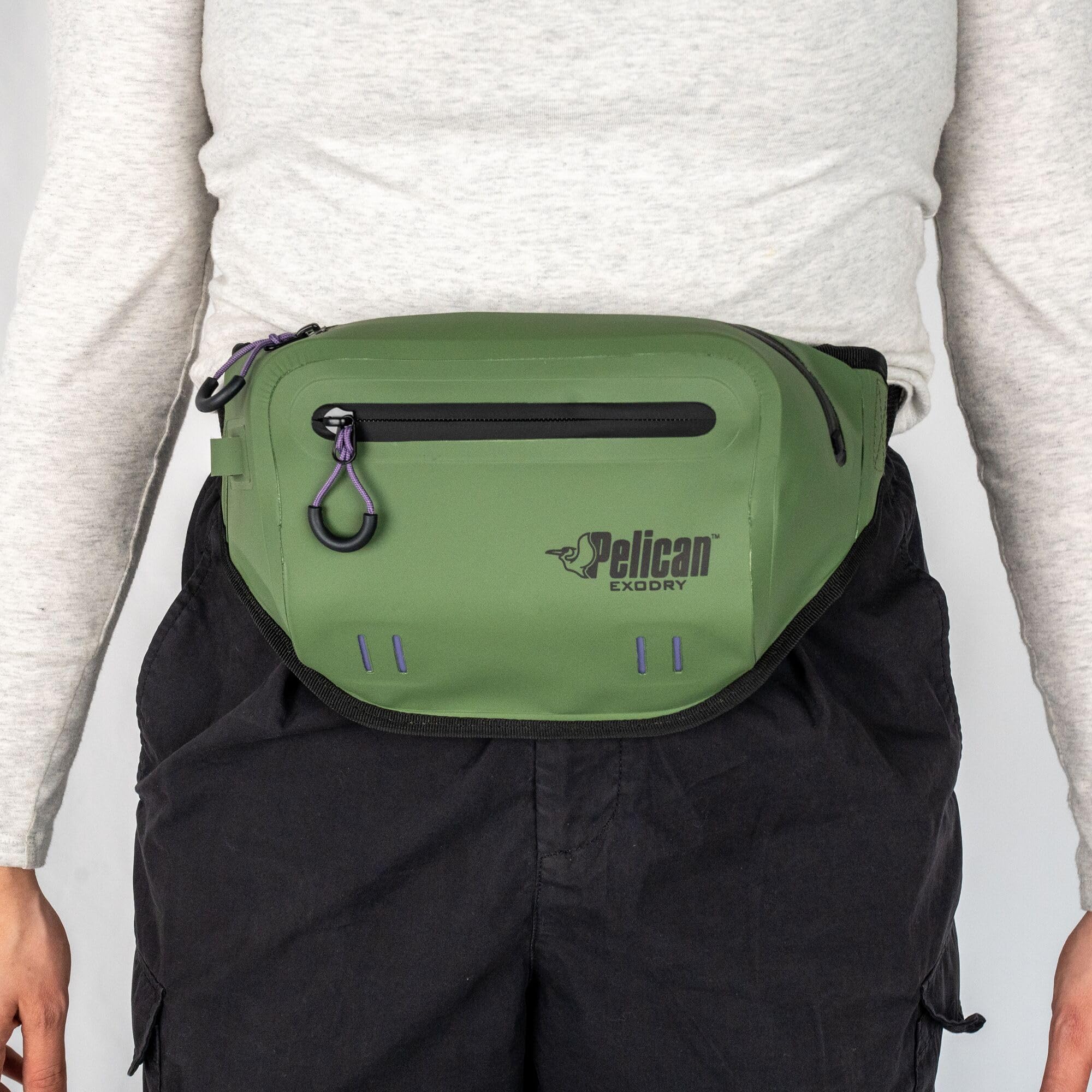 Pelican Exodry next to measuring tape showing adjustable fit and capacity