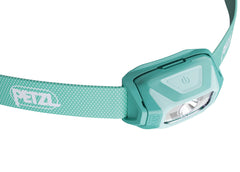 PETZL TIKKINA in hand scale image showing compact size and pocketable benefit