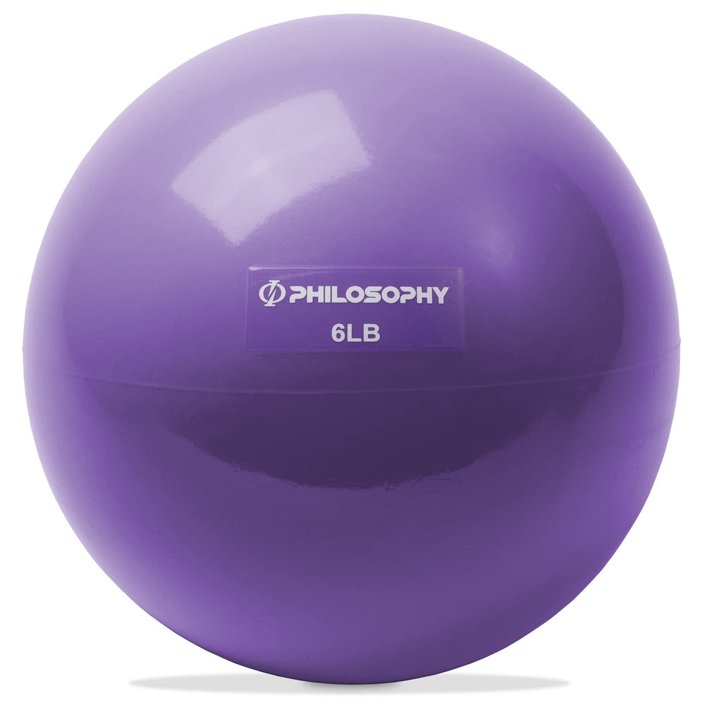 Philosophy Gym toning ball front view showing purple exterior and compact shape, durable and portable