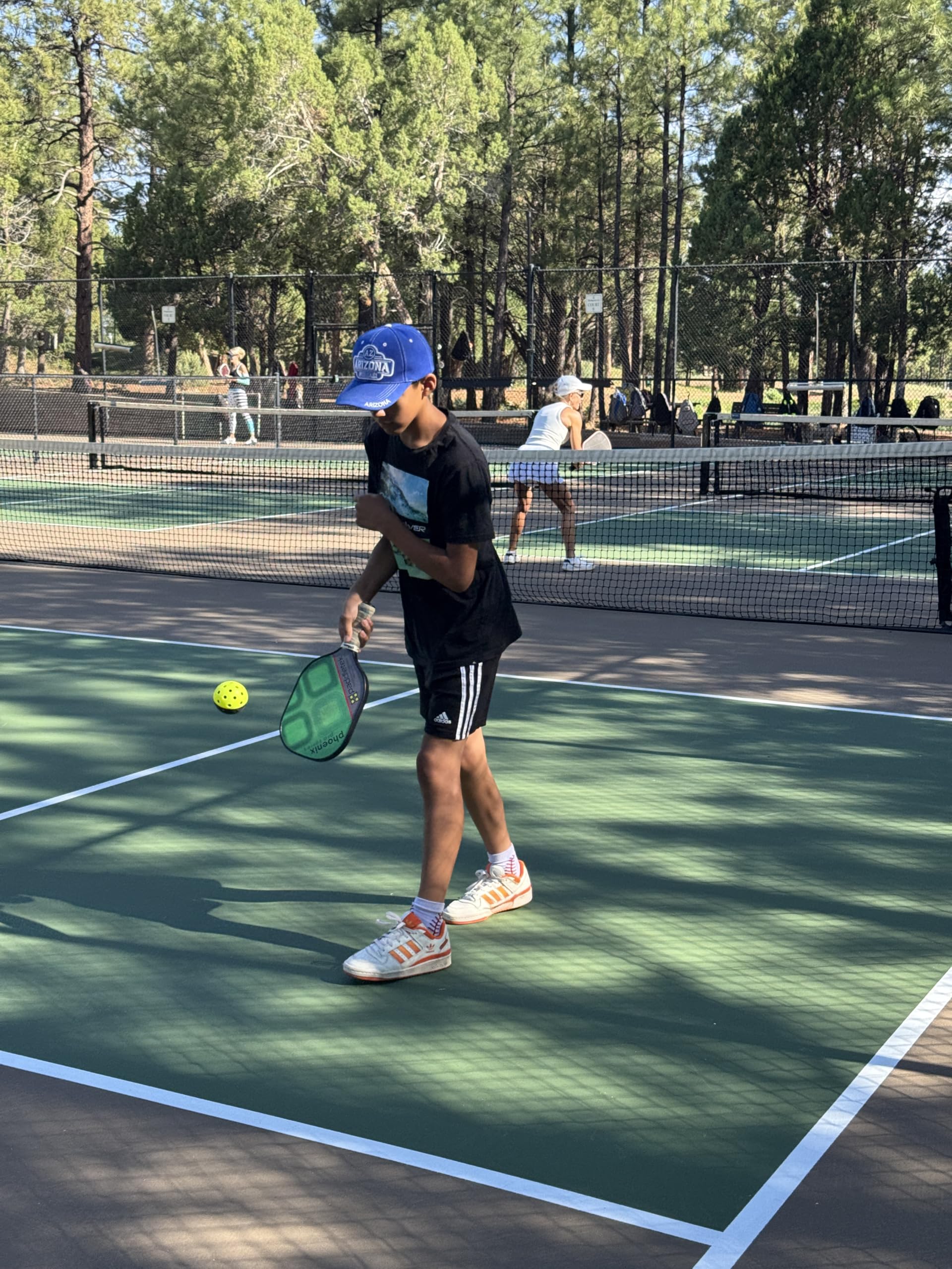 PickleProGear on-court lifestyle shot showing efficient solo drills and focus