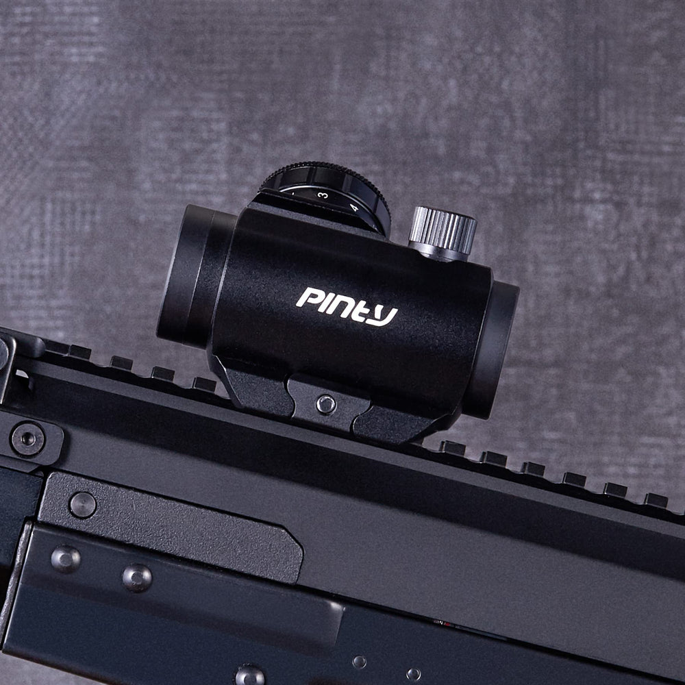 Pinty mounted on rifle demonstrating co-witness with iron sights
