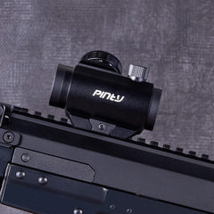 Pinty mounted on rifle demonstrating co-witness with iron sights