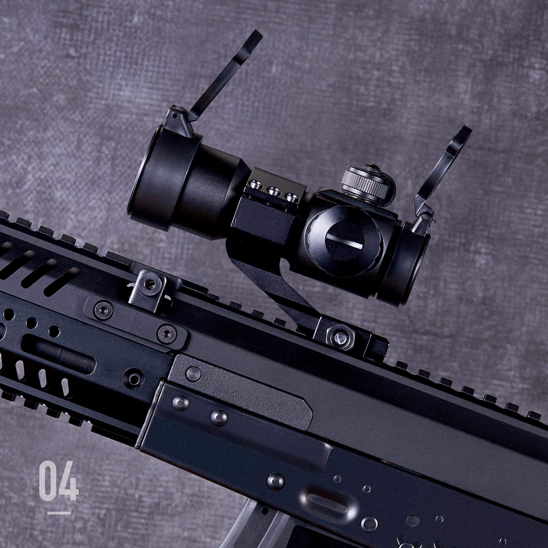 Pinty close-up of adjustment knobs and illuminated red green reticle for fast aiming