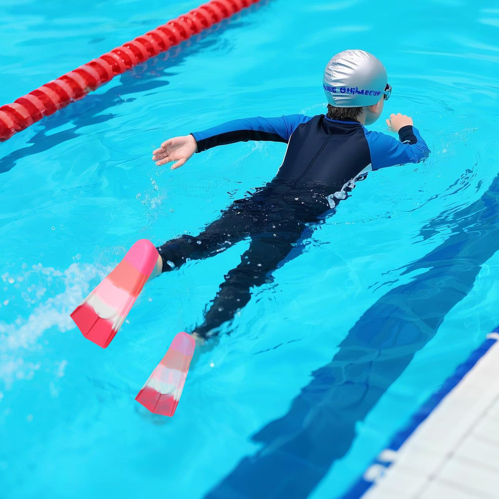 pippia child using fins in pool improving kick technique with stability