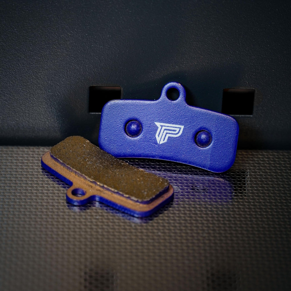 PIVOTRAX brake pad installed on electric dirt bike demonstrating secure fit