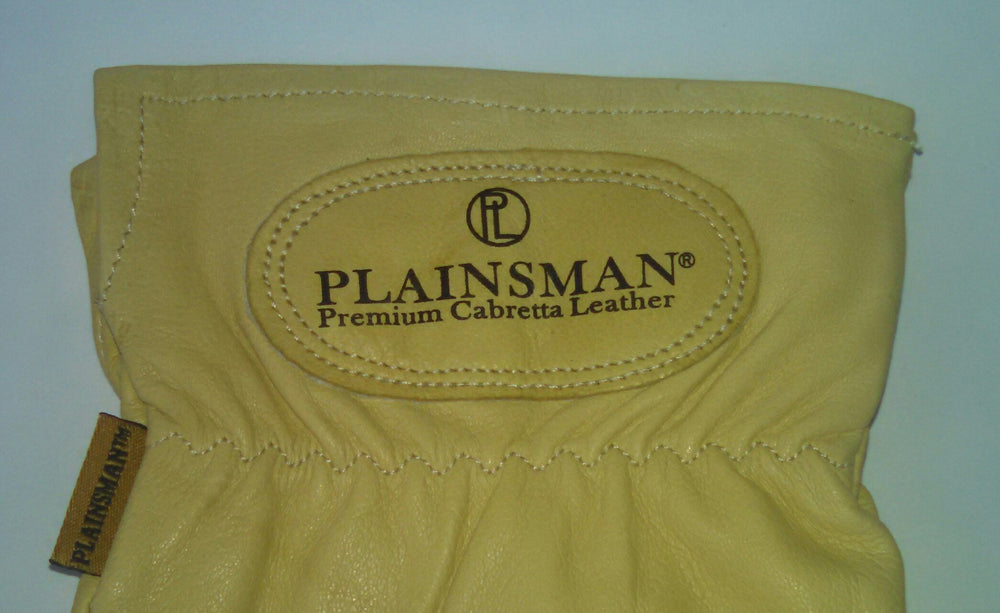 Plainsman gloves worn while handling tools demonstrating grip and dexterity