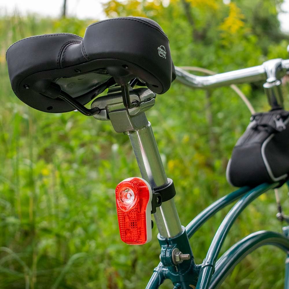 Planet Bike Superflash clipped to a backpack illustrating portable visibility on gear
