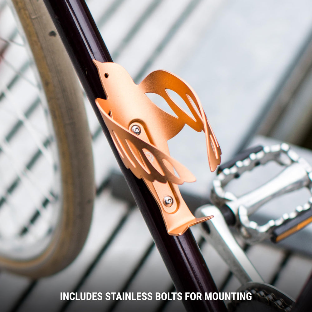Portland Design Works Sparrow Cage next to a coin showing compact size and lightweight advantage