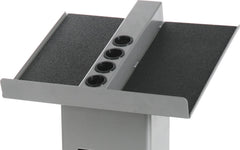 POWERBLOCK stand holding full dumbbells and adders for fast weight changes