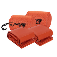 Prepared Hero front packaging showing two orange emergency bivy bags and compact packability benefit