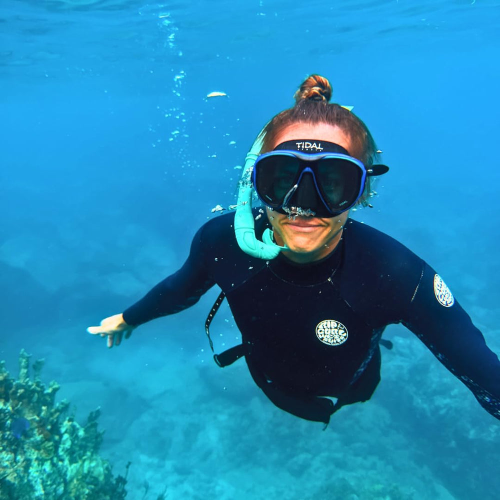 Pro Shot model wearing Tidal Mask in water showing improved underwater visibility
