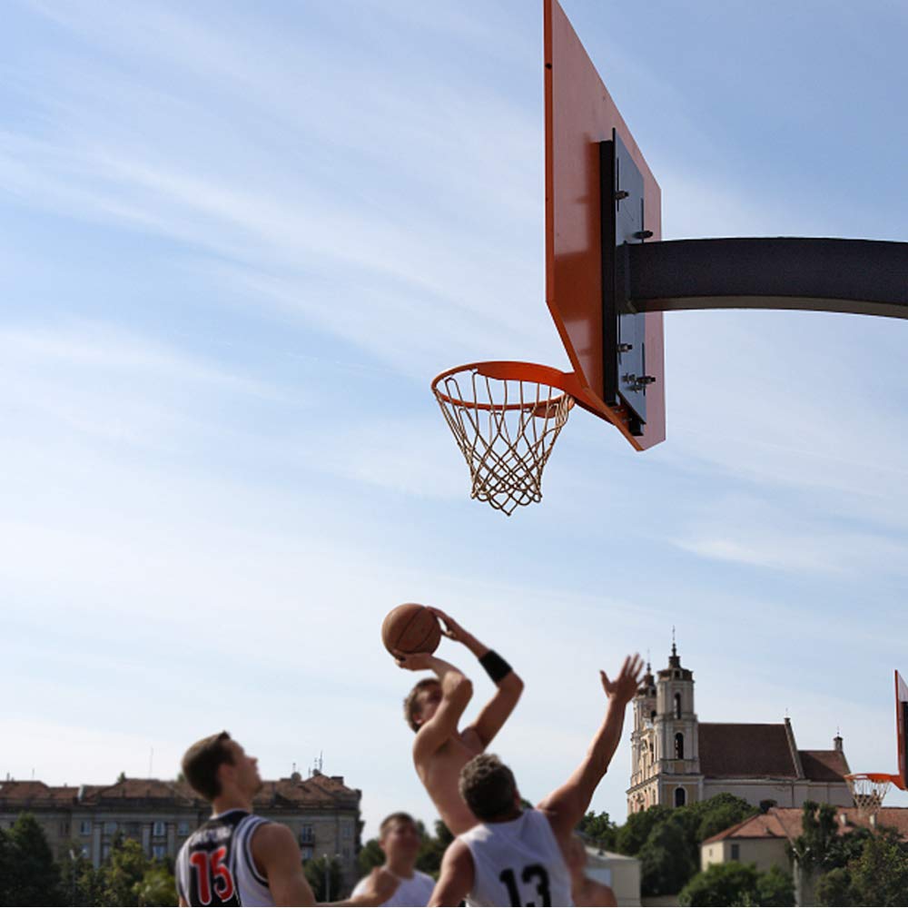 ProSlam installed on driveway backboard during play demonstrates outdoor resilience