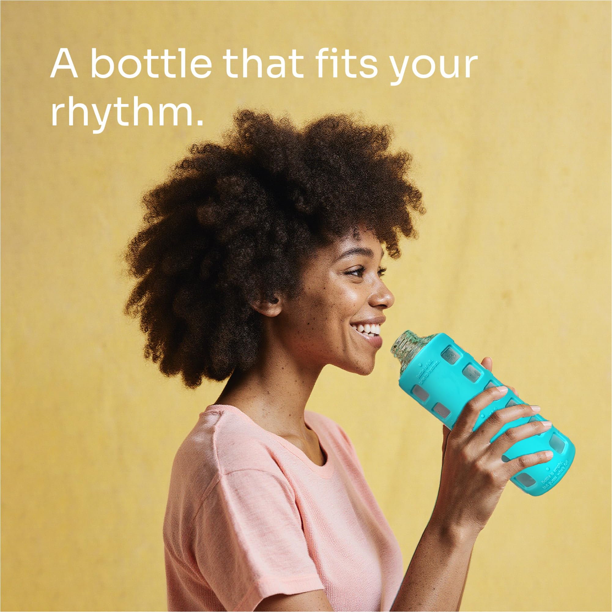 purifyou bottle beside gym mat showing workout-ready portability and non-slip sleeve