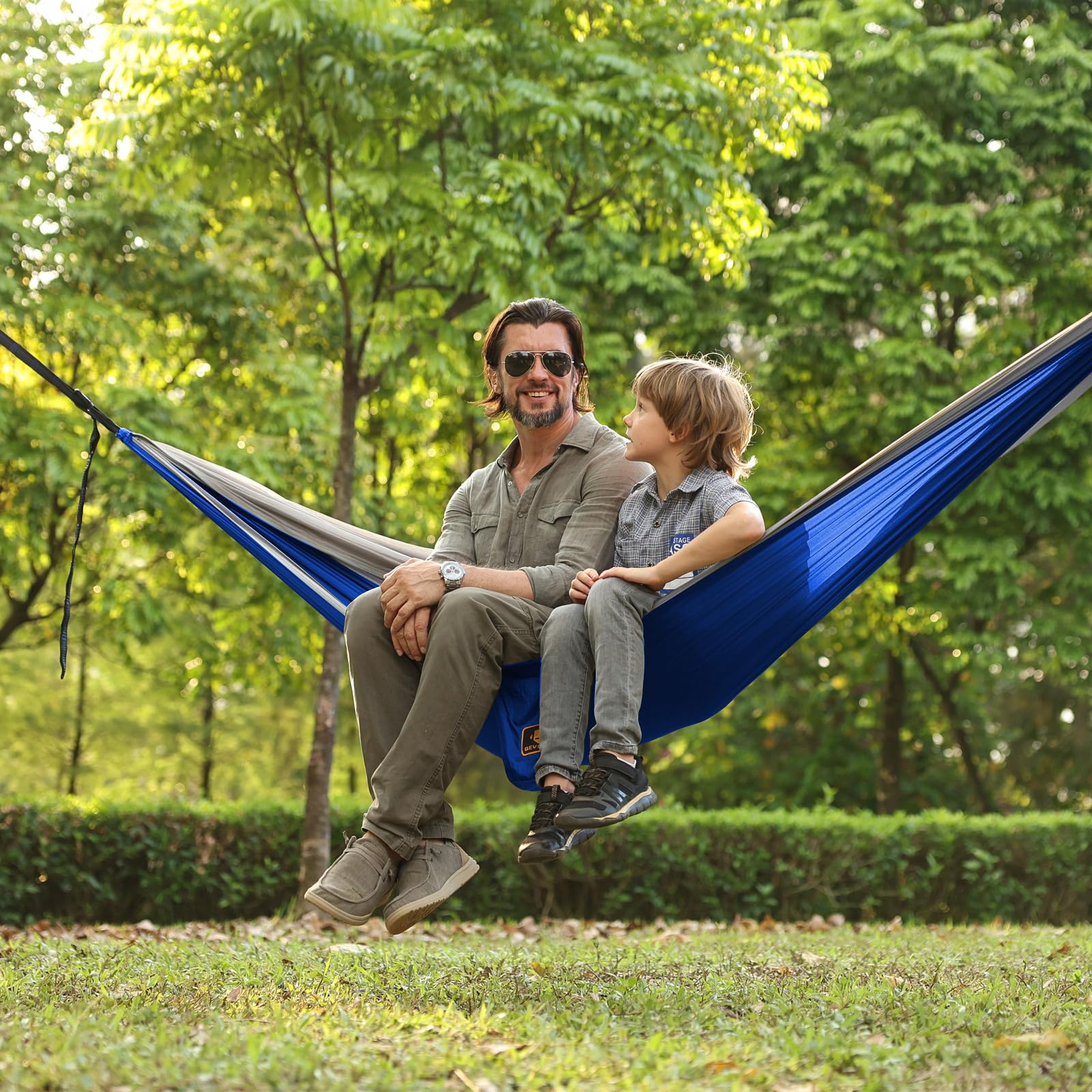 Qevooon hammock set up at dusk showing relaxing protected outdoor comfort benefit