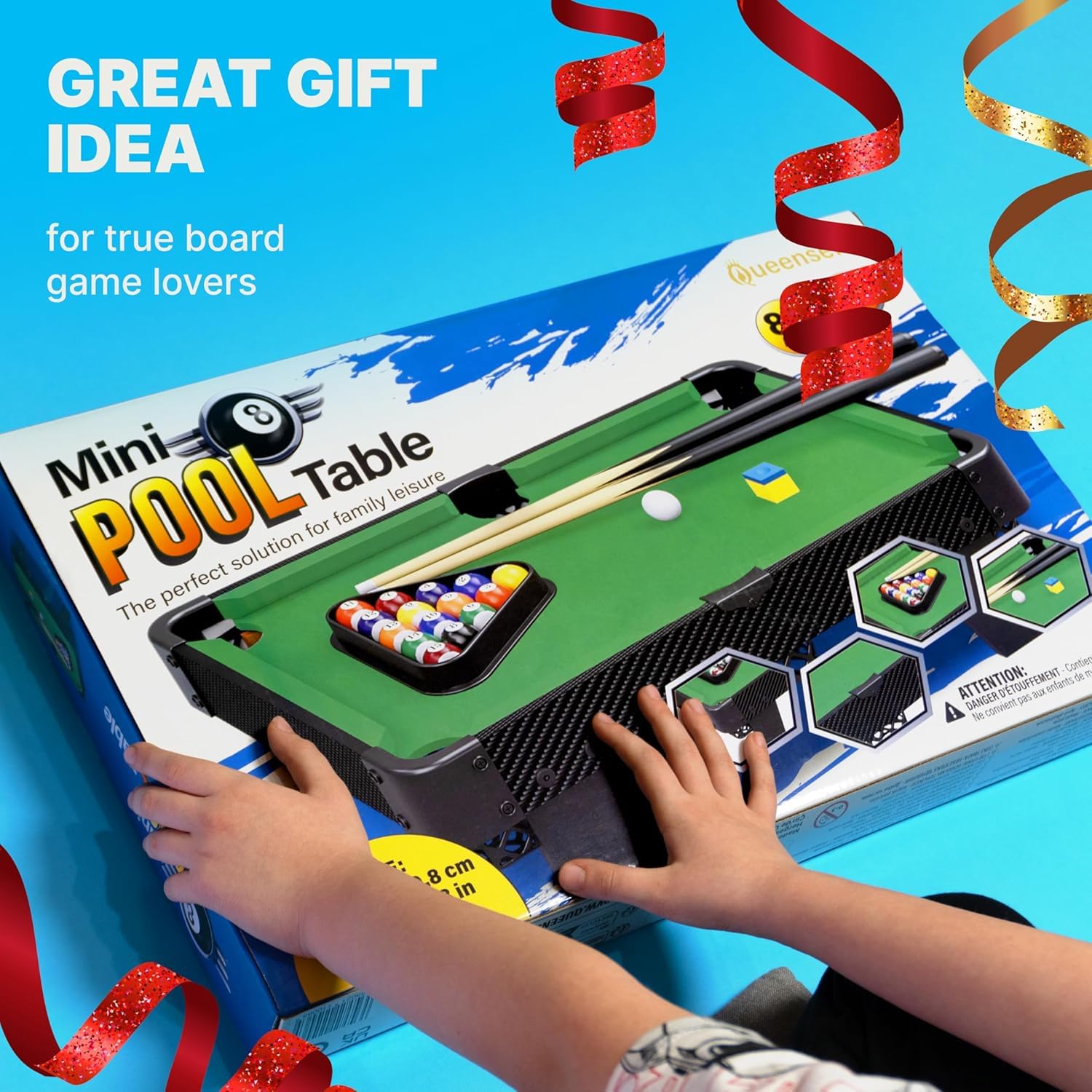 Queensell family playing in living room enjoying social tabletop billiards