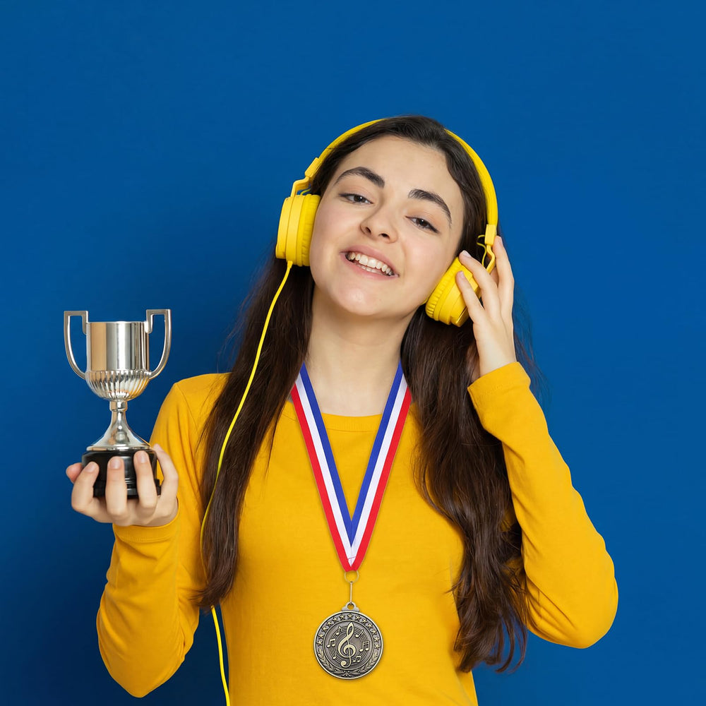 Quelay medal worn by student onstage showcasing visible recognition benefit