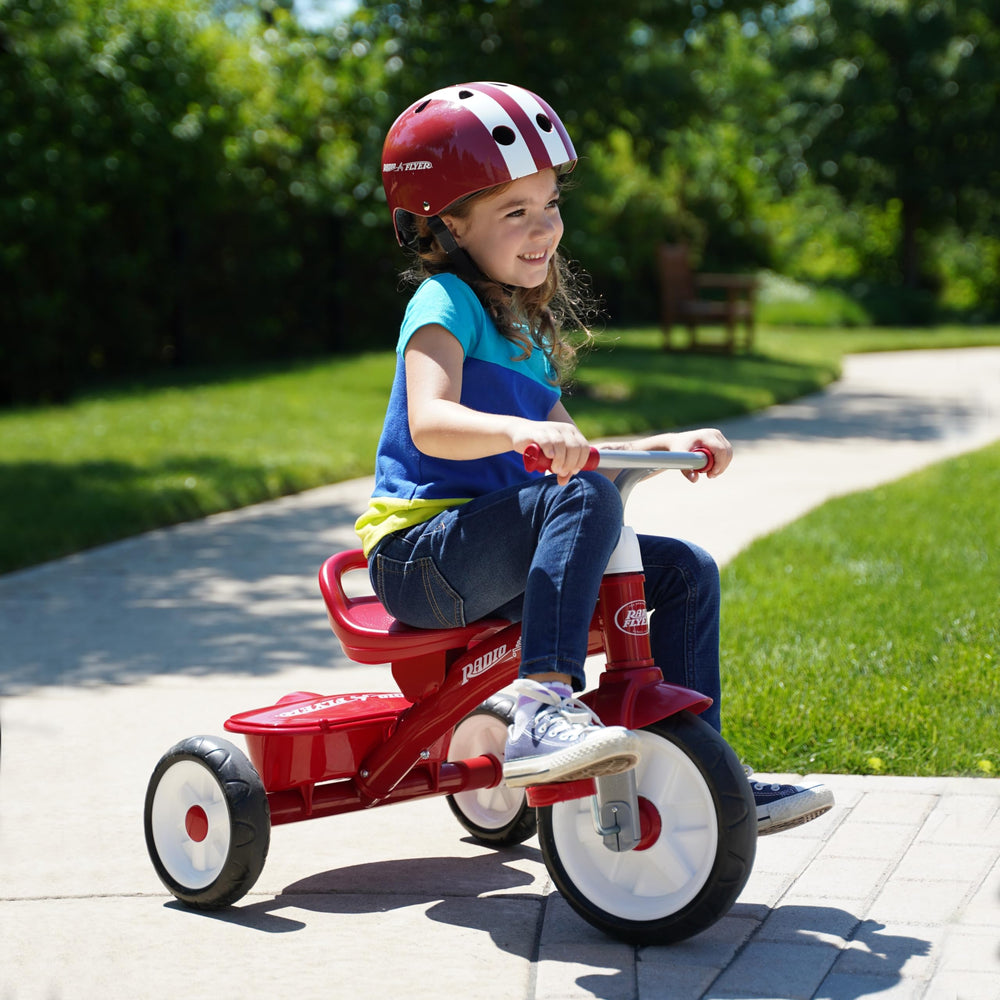 Radio Flyer pink helmet chin strap detail showing quick-release buckle for secure fastening