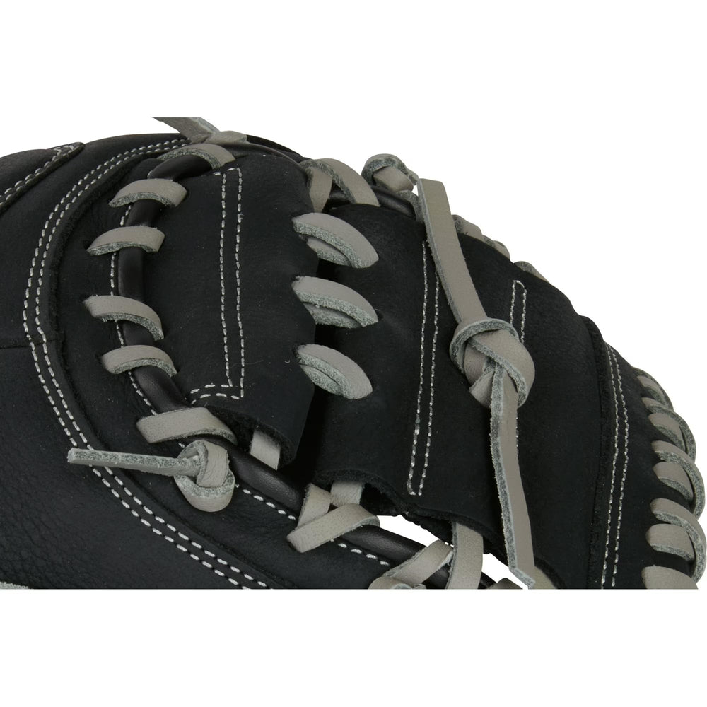 Rawlings mitt held in a youth hand showing 33-inch scale and control