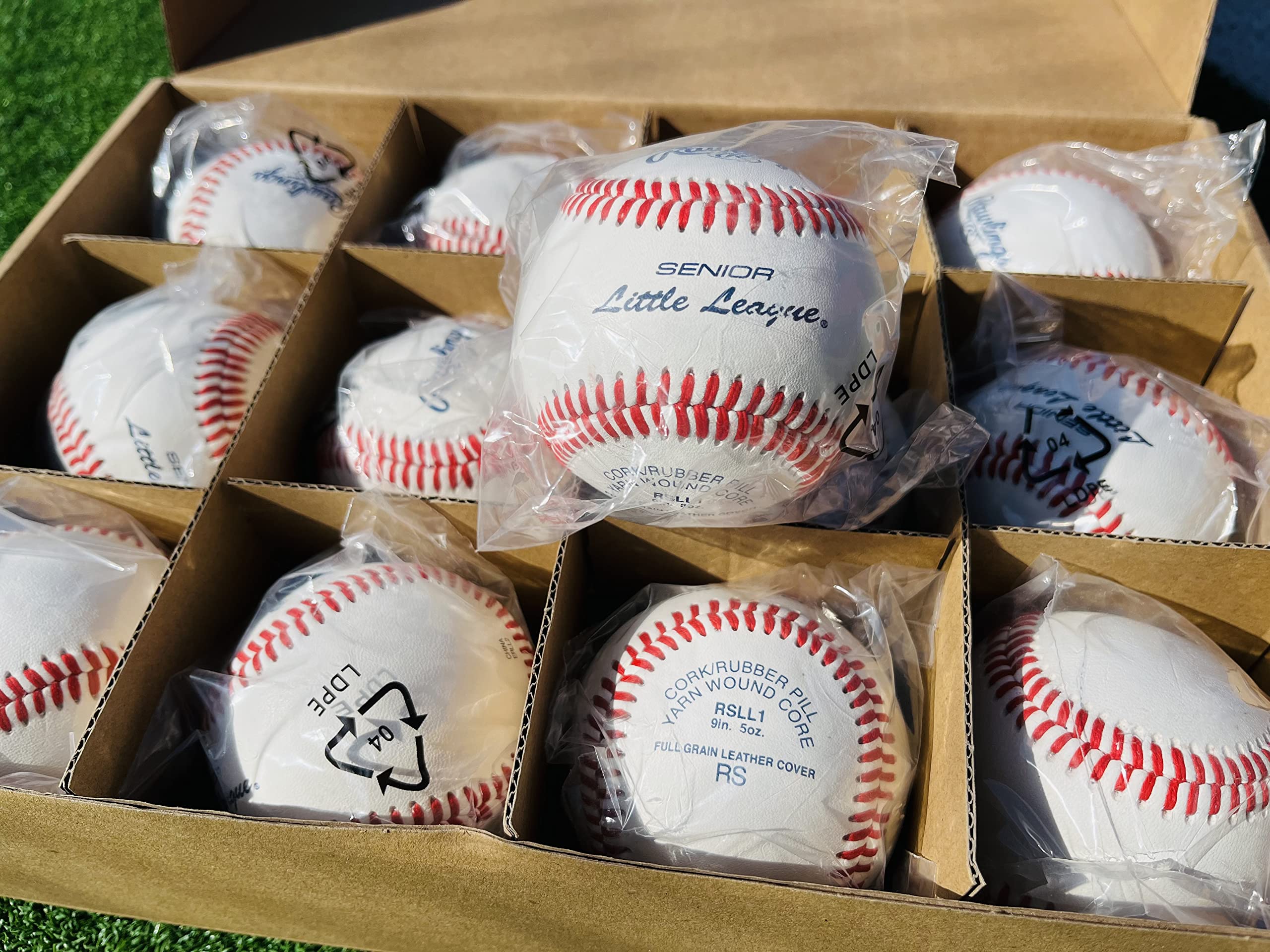 Rawlings ball in pitcher’s hand highlighting seam grip for control