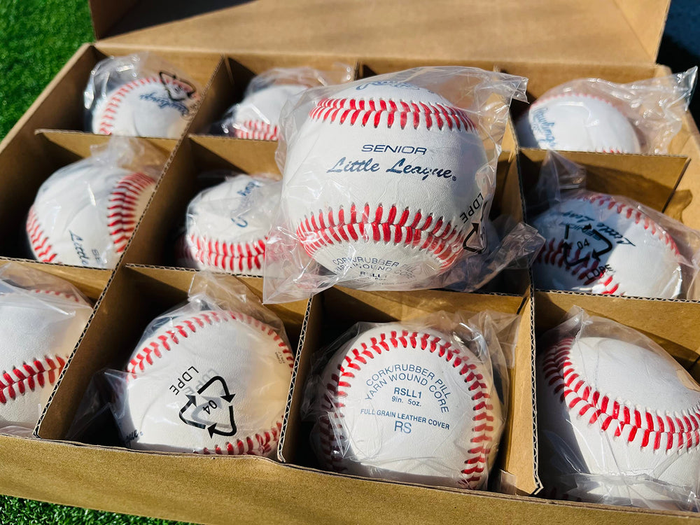 Rawlings ball in pitcher’s hand highlighting seam grip for control
