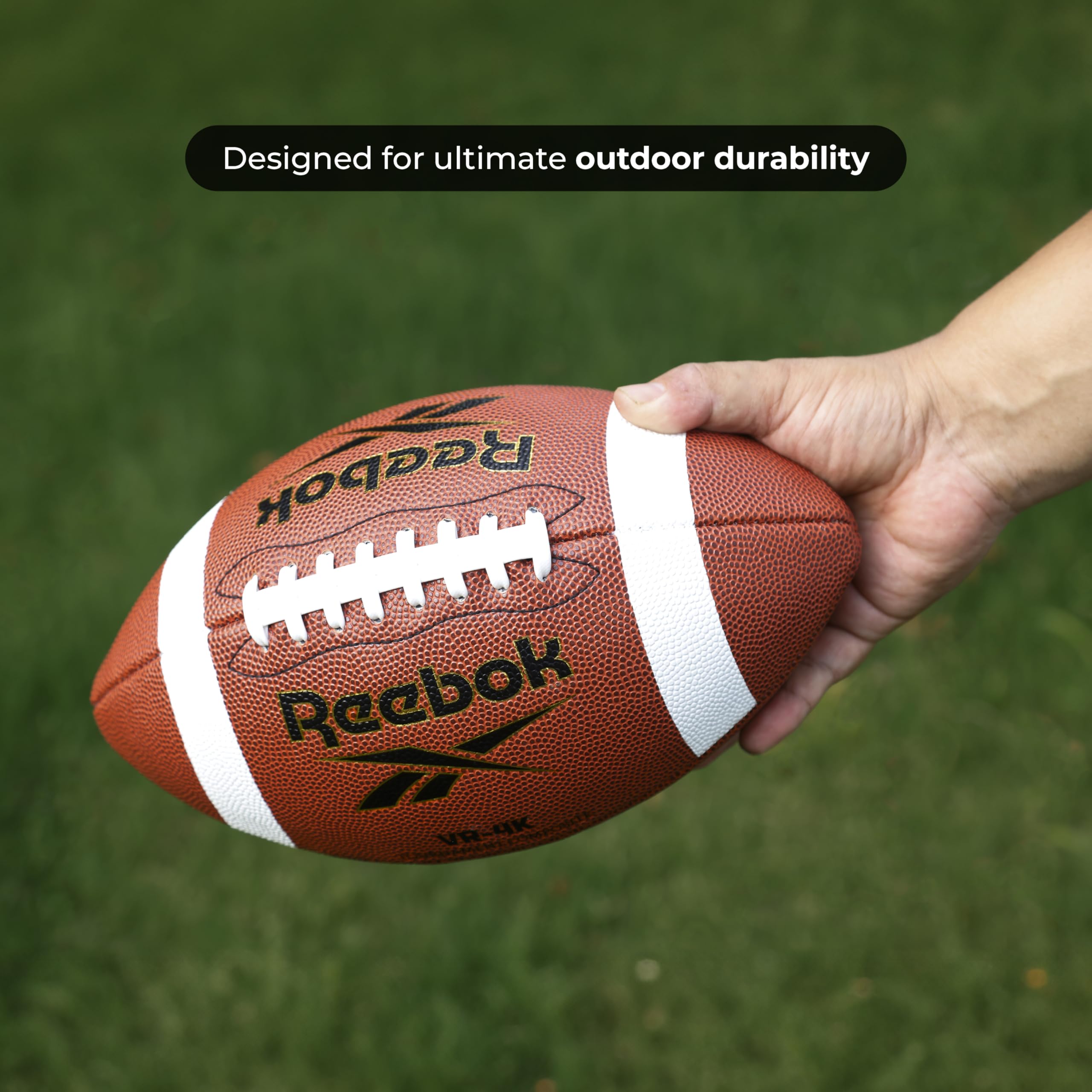 Reebok football mid-air pass in park demonstrating accurate flight performance