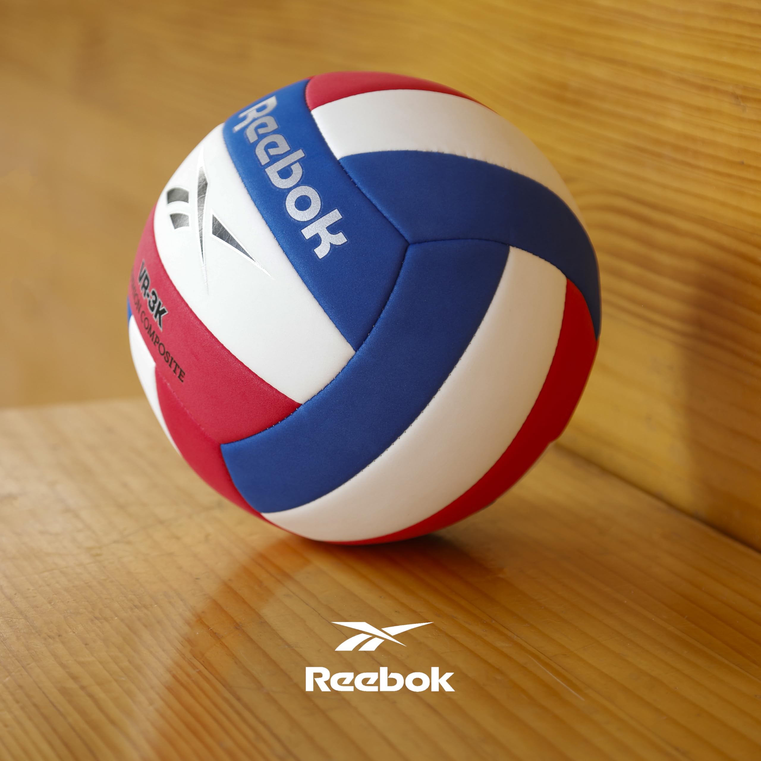 Reebok ball next to a hand showing size 5 scale benefit