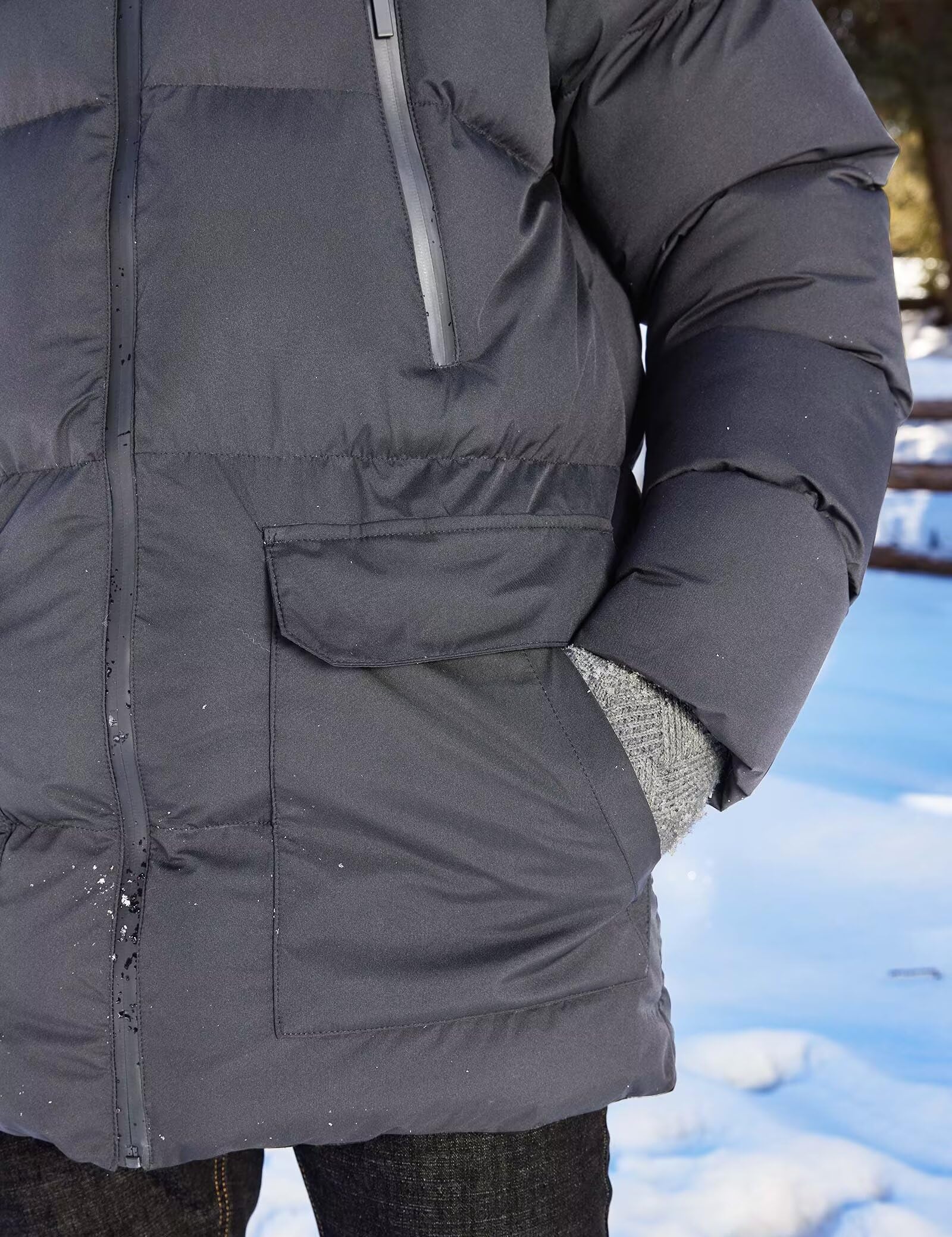 Rejork parka on model for scale showing extended length and full upper-body coverage