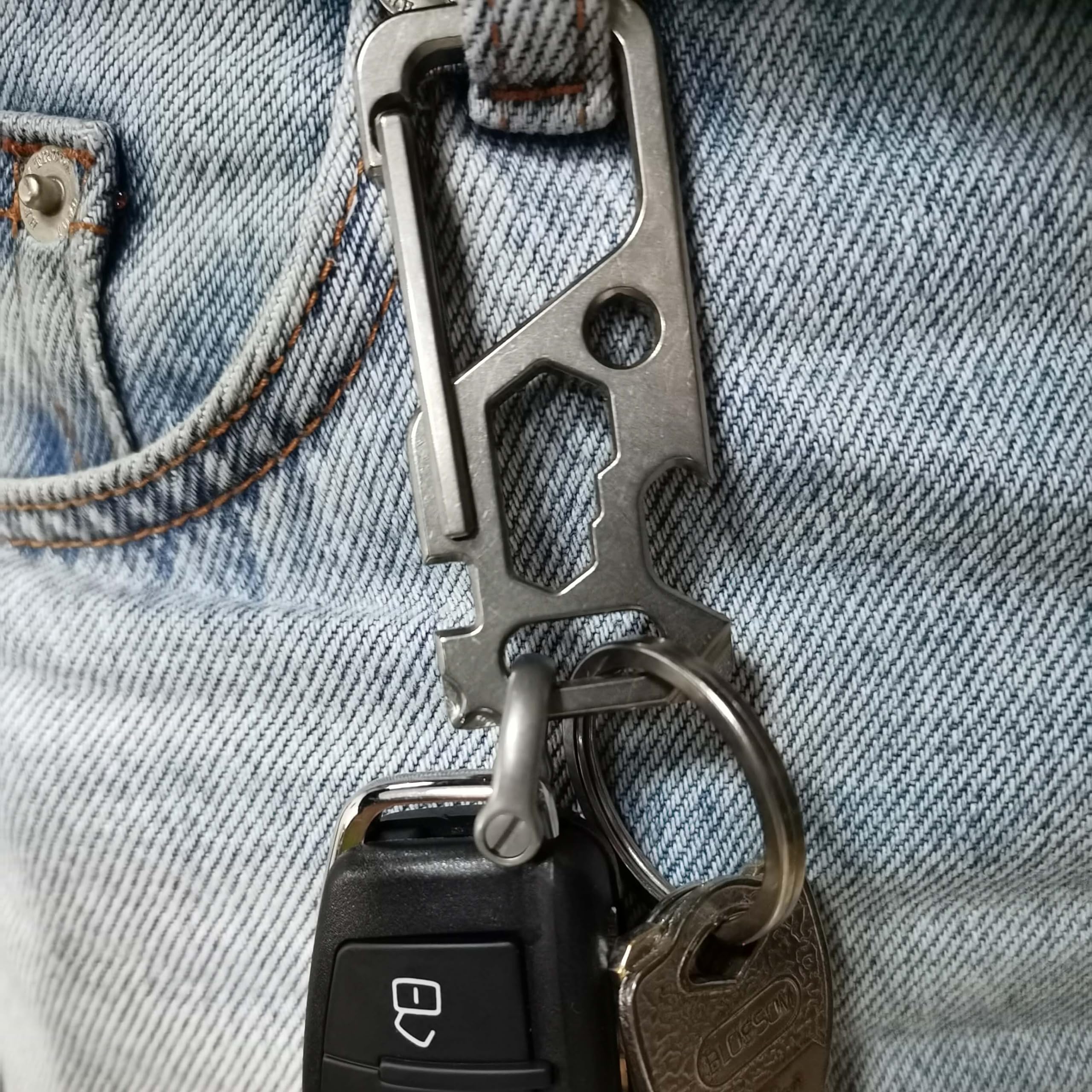 ResafeLy carabiner clipped to belt loop showing quick one-handed access benefit