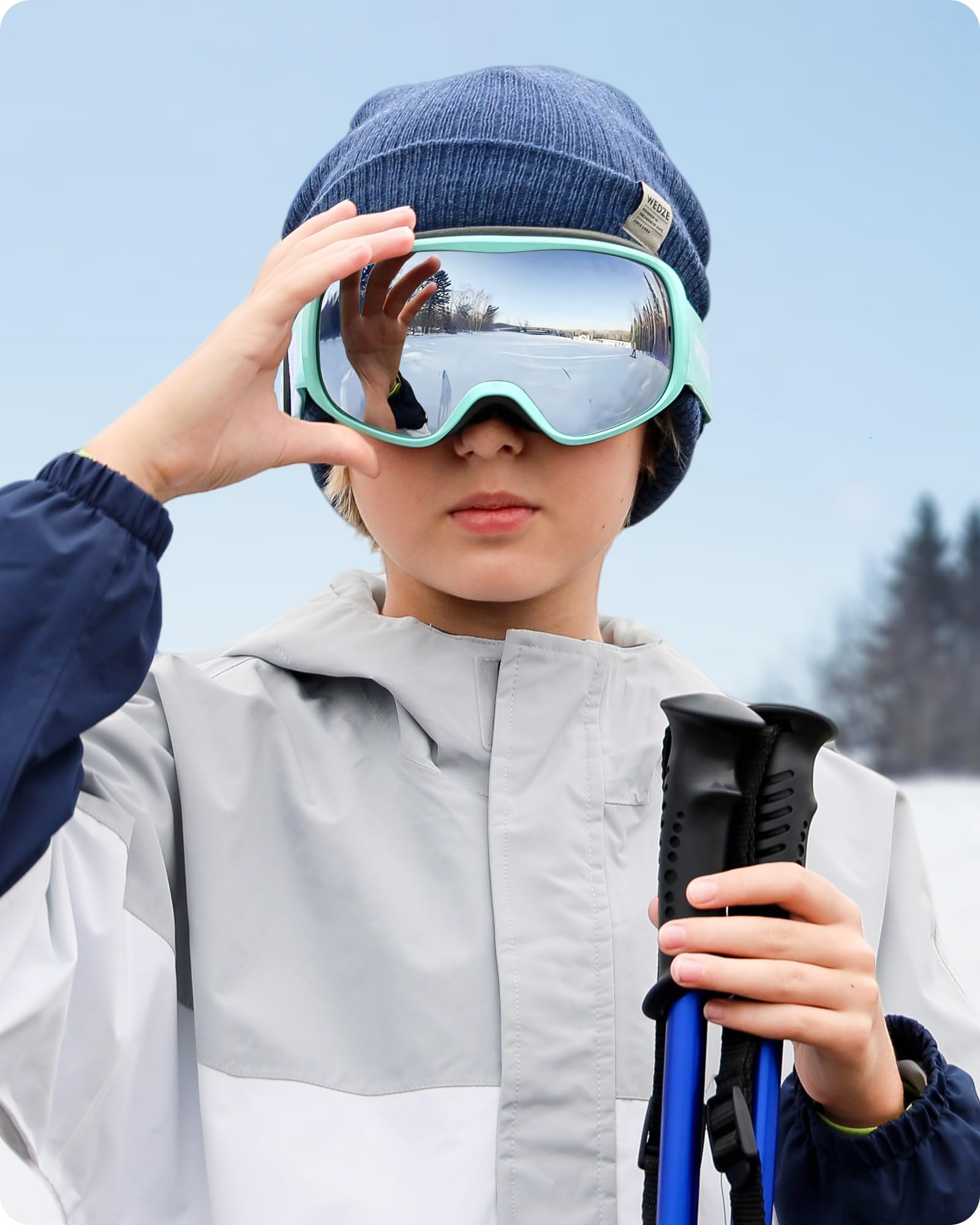 RIOROO goggles next to hand and box showing size scale and ready-to-pack convenience