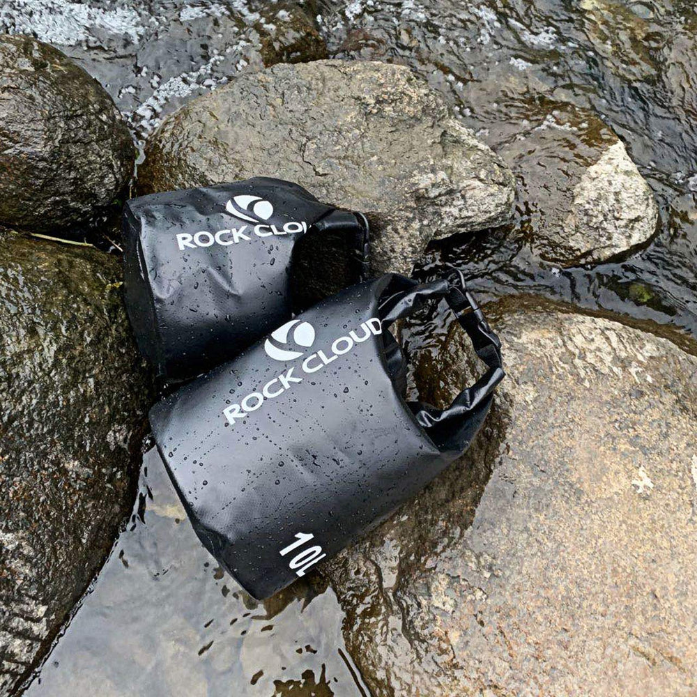 ROCK CLOUD dry bag resting on sand for easy beach cleanup and protection