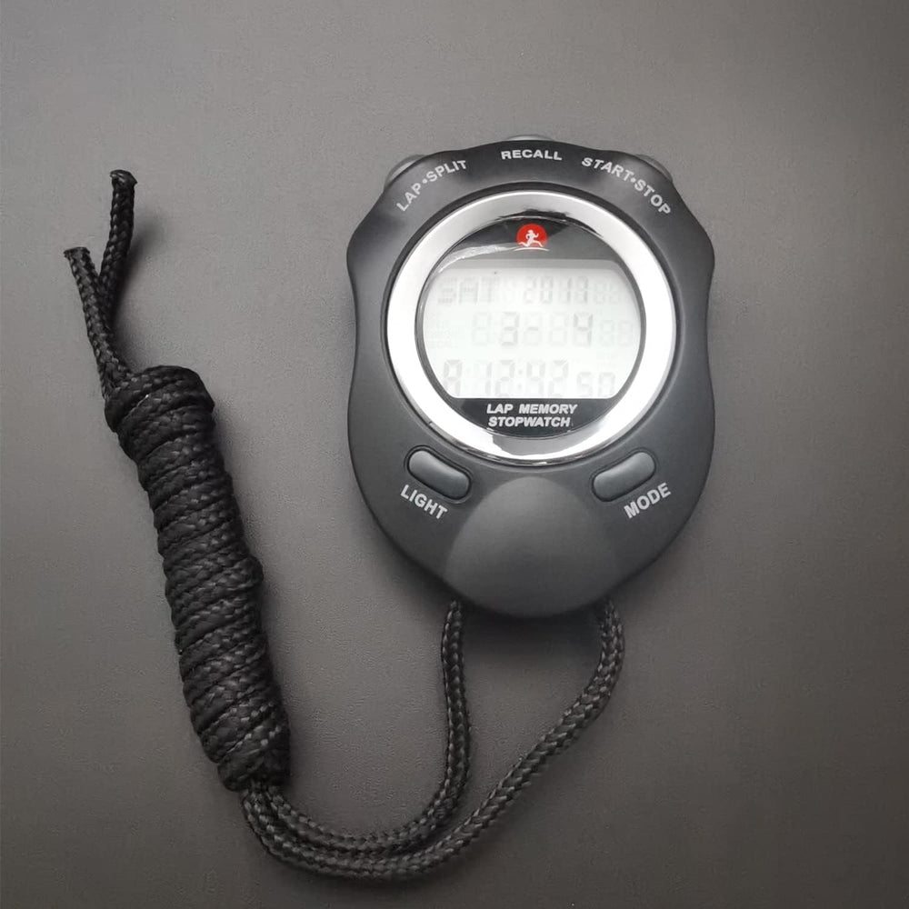 Rolilink next to smartphone showing compact size and portability