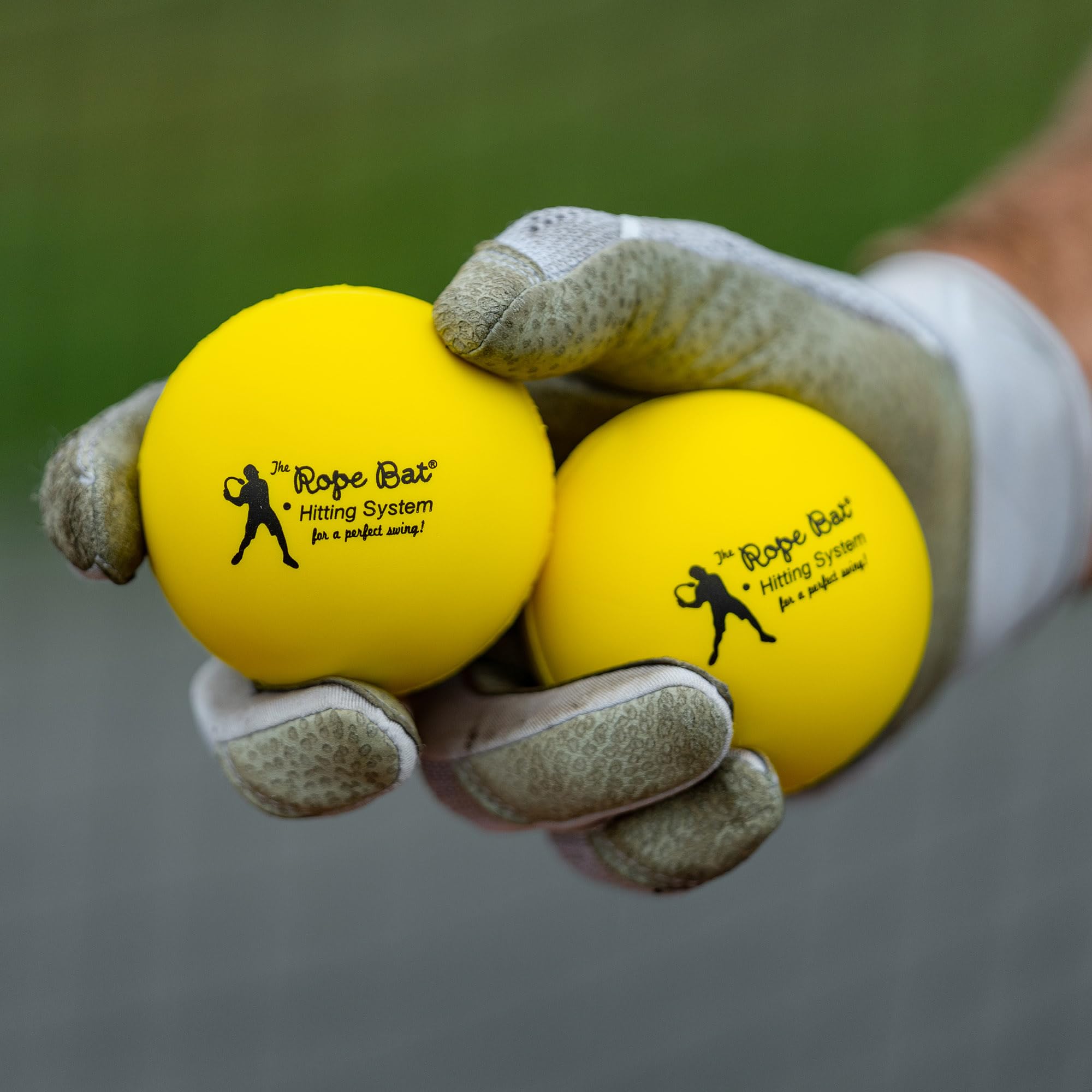 Rope Bat ball held in hand showing size comparison for realistic practice