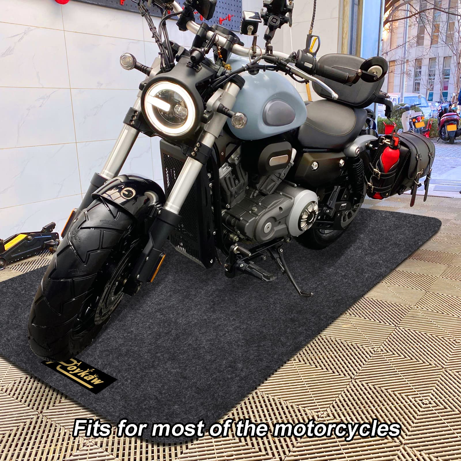 Roykaw mat under motorcycle protecting garage floor from oil and drips