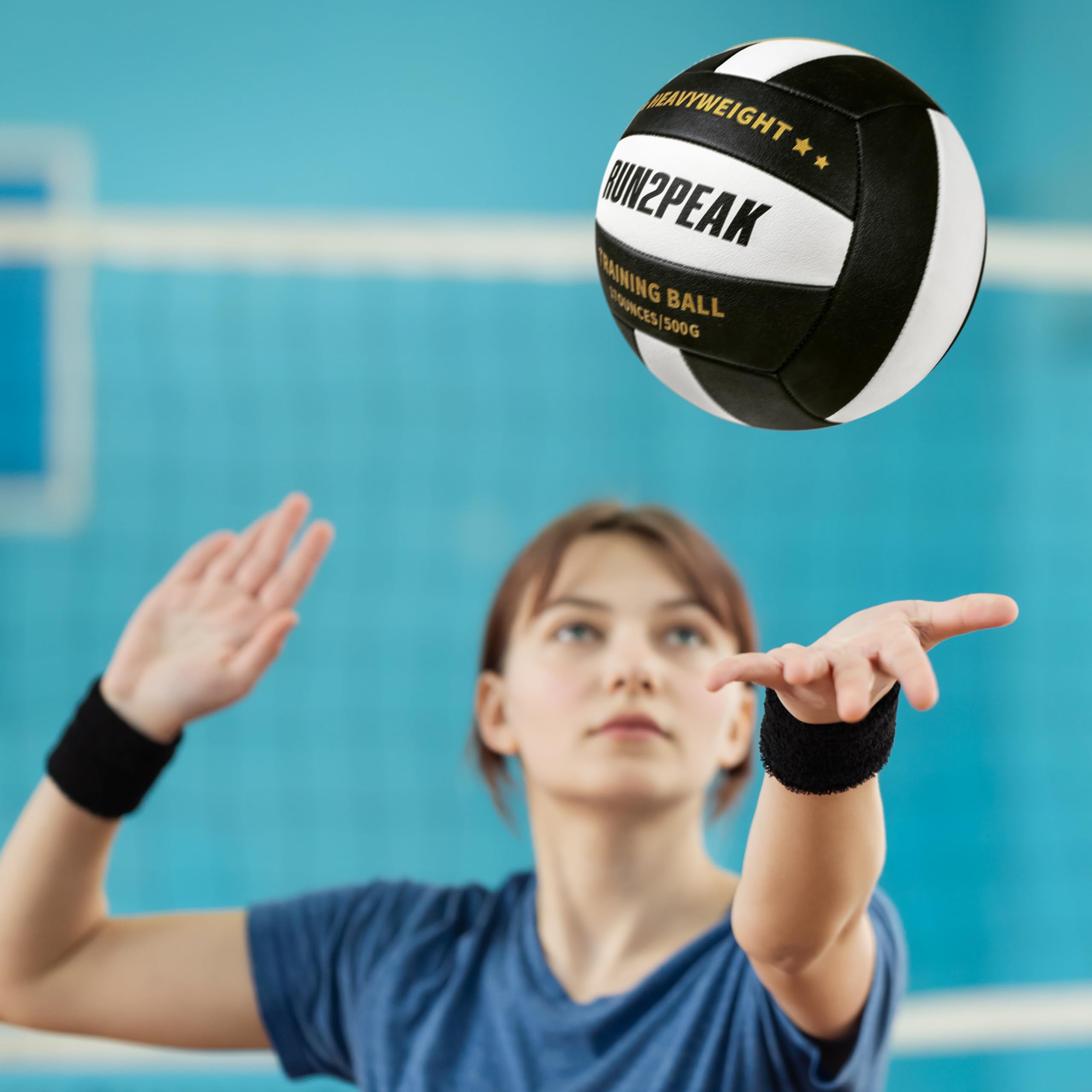 RUN2PEAK setter practicing a setting drill with weighted ball to build power and control
