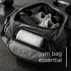 S&T INC. folded towel in gym bag, compact packing and travel ready