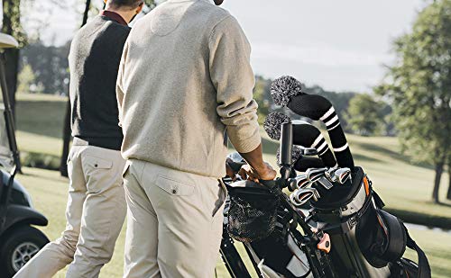 Scott Edward lifestyle image of golfer carrying bag with covers for protection