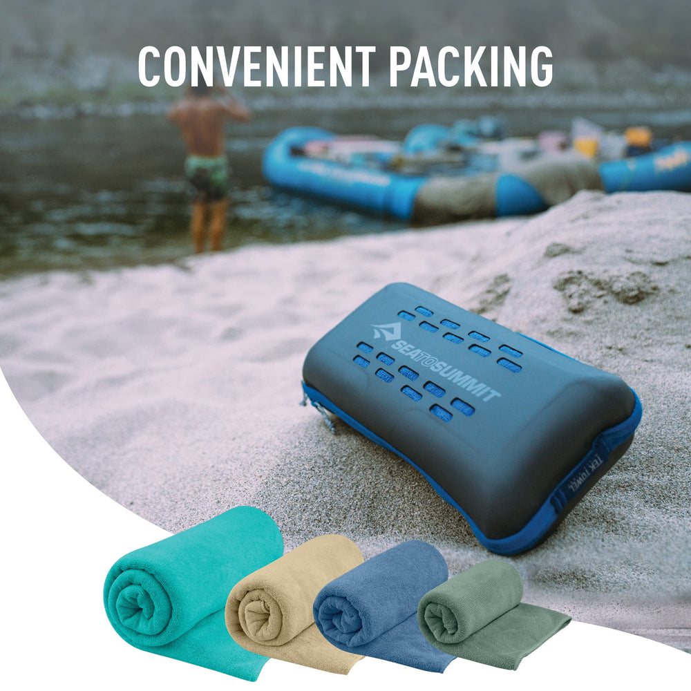 Sea to Summit towel clipped to backpack showing hands-free drying advantage