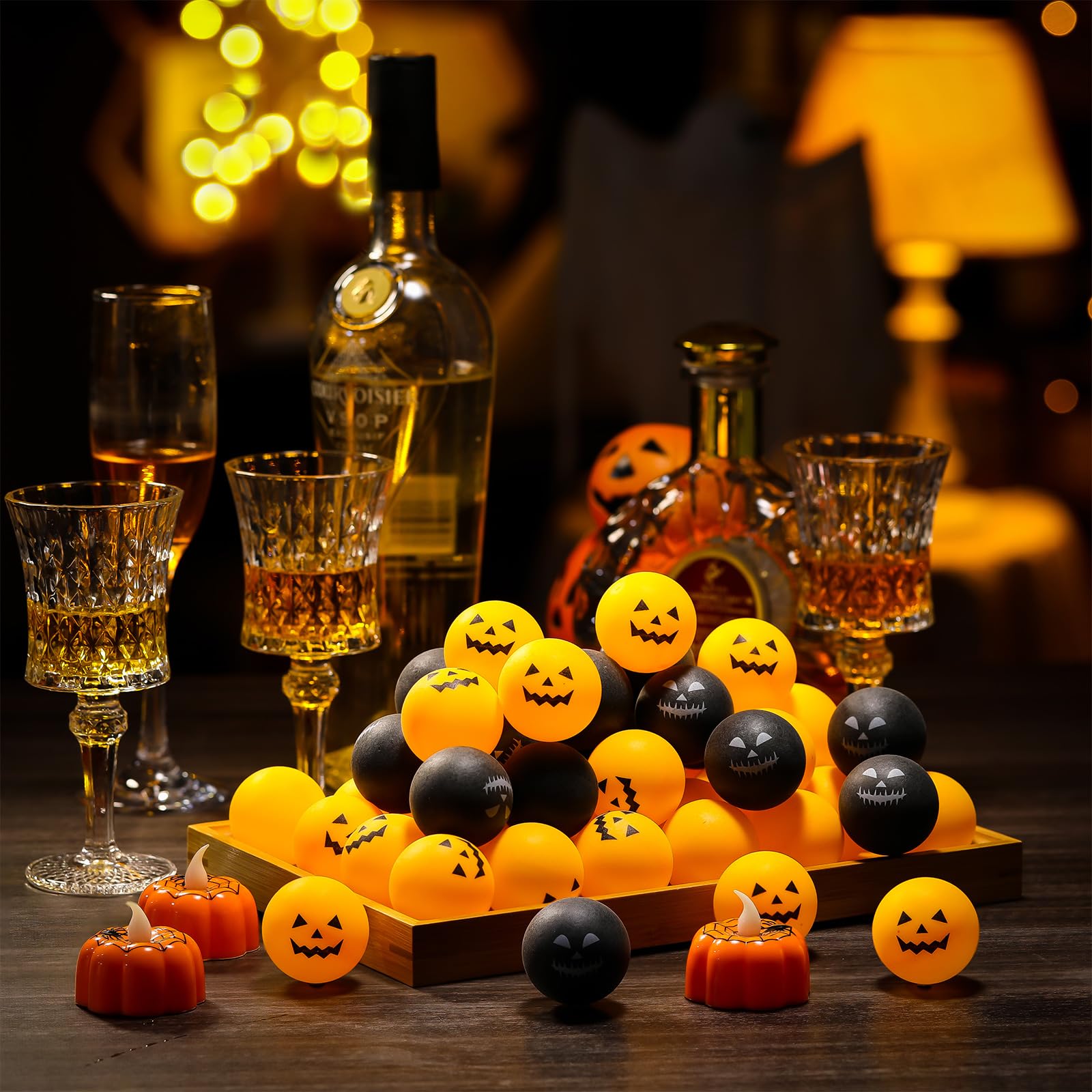 Seenelling orange and black balls arranged as a Halloween table centerpiece