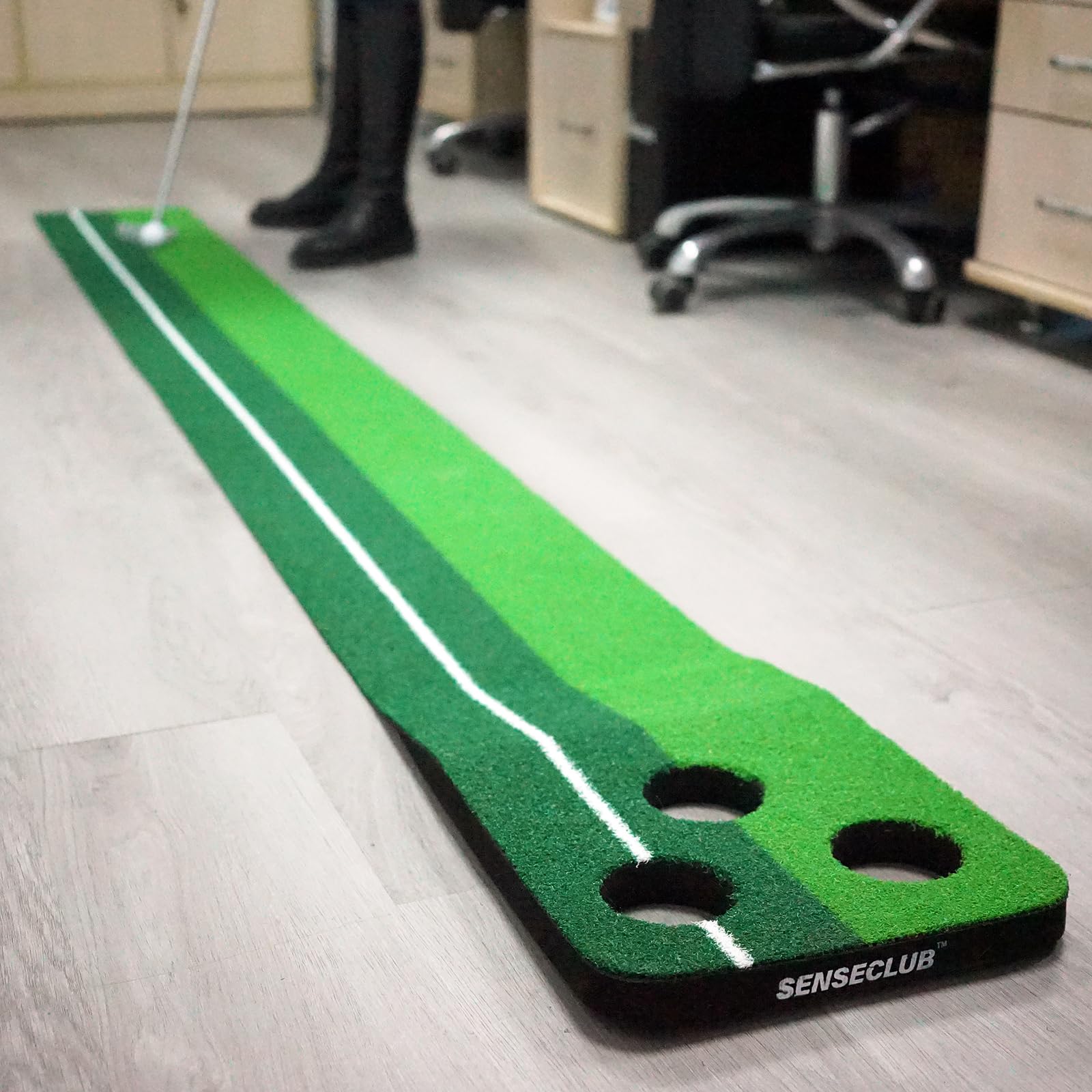 SENSECLUB family playing multiplayer putting game, boosts social engagement