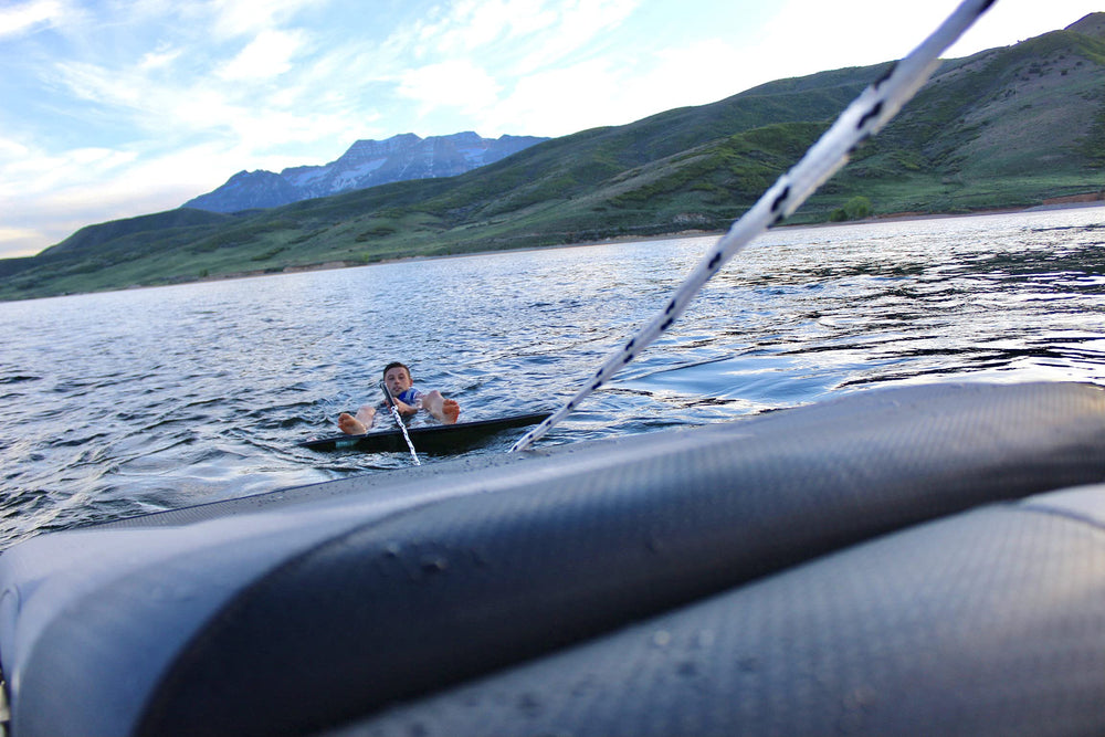 Shaka Pro lifestyle shot of rope by board and boat highlighting easy transport