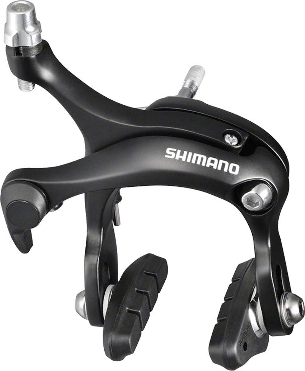 SHIMANO BR-R451 front caliper mounted on road fork showing compact black finish and precise stopping