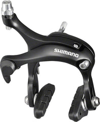SHIMANO BR-R451 front caliper mounted on road fork showing compact black finish and precise stopping